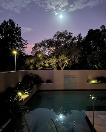 Shimmering moonlight around the pool