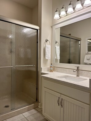 Combined shower/tub, hair dryer, towels, soap