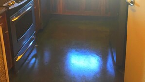 A compact kitchen with a stove, oven, sink, and refrigerator. - In the HEART of Ocean Drive in North Myrtle Beach (North Myrtle Beach)