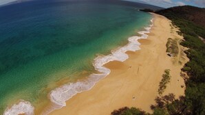 A beach with clear turquoise waters and a sandy shore. - #605 Top Floor Unobstructed Ocean View/Sunsets,  New quiet A.C. (Kihei)