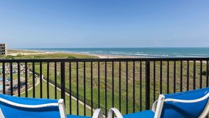 A balcony with a view of the beach and ocean. - Saida II 502 - Charming Oceanfront Condo with Spectacular Ocean Views, Dazzling Beachfront Swimming Pools & Spas (South Padre Island)