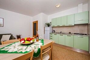Apartment, 2 Bedrooms, Balcony (A5) | Private kitchen | Fridge, stovetop, coffee/tea maker, electric kettle - Apartments Bella (Rovinj)