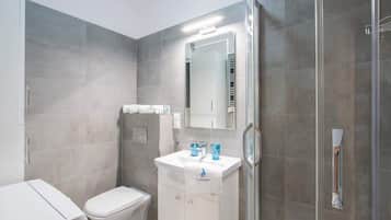 Shower, hair dryer, towels, shampoo