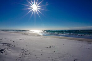 On the beach, sun-loungers