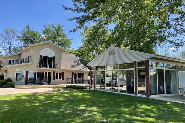 Main house with screened & glass sunroom. The sunroom is not climate contolled.