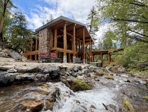 Classic mountain retreat • Right on the stream • Hot tub • Wood-burning stove • Set in Sundance Canyon