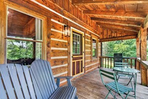 A wooden cabin with a porch, a grill, and seating. - Falling Leaf Cabin Rustic Charm With Modern Decor! High Speed Internet!  (Rileyville)