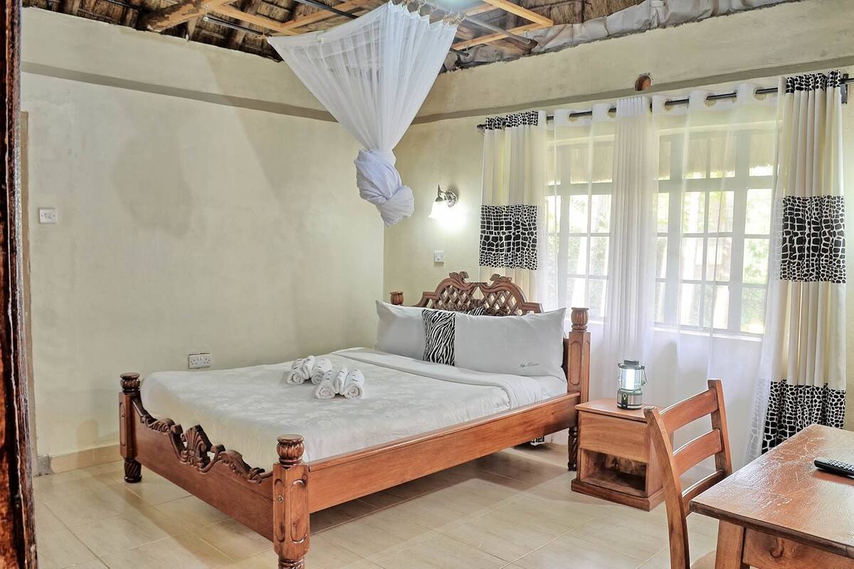 Apartamento família, 2 quartos, para não fumantes, vista para o jardim | Cofres nos quartos, quartos à prova de som, Wi-Fi de cortesia