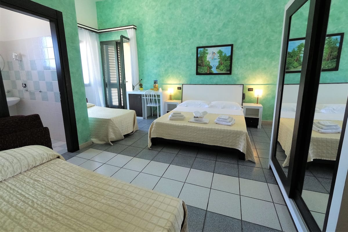 Standard Quadruple Room, Sea View | 1 bedroom, minibar, desk, laptop workspace