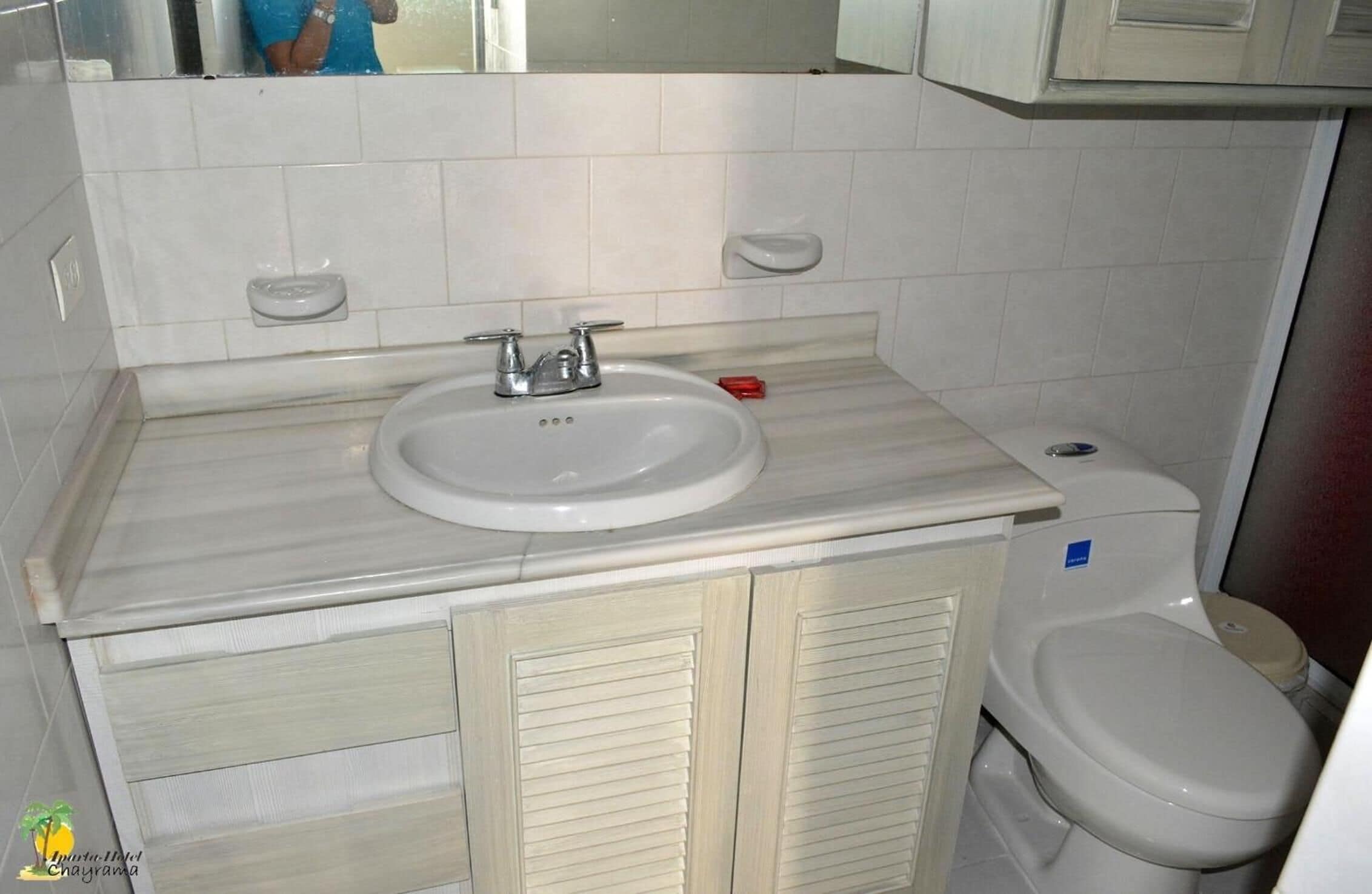 deluxe room | bathroom | shower, rainfall showerhead, towels