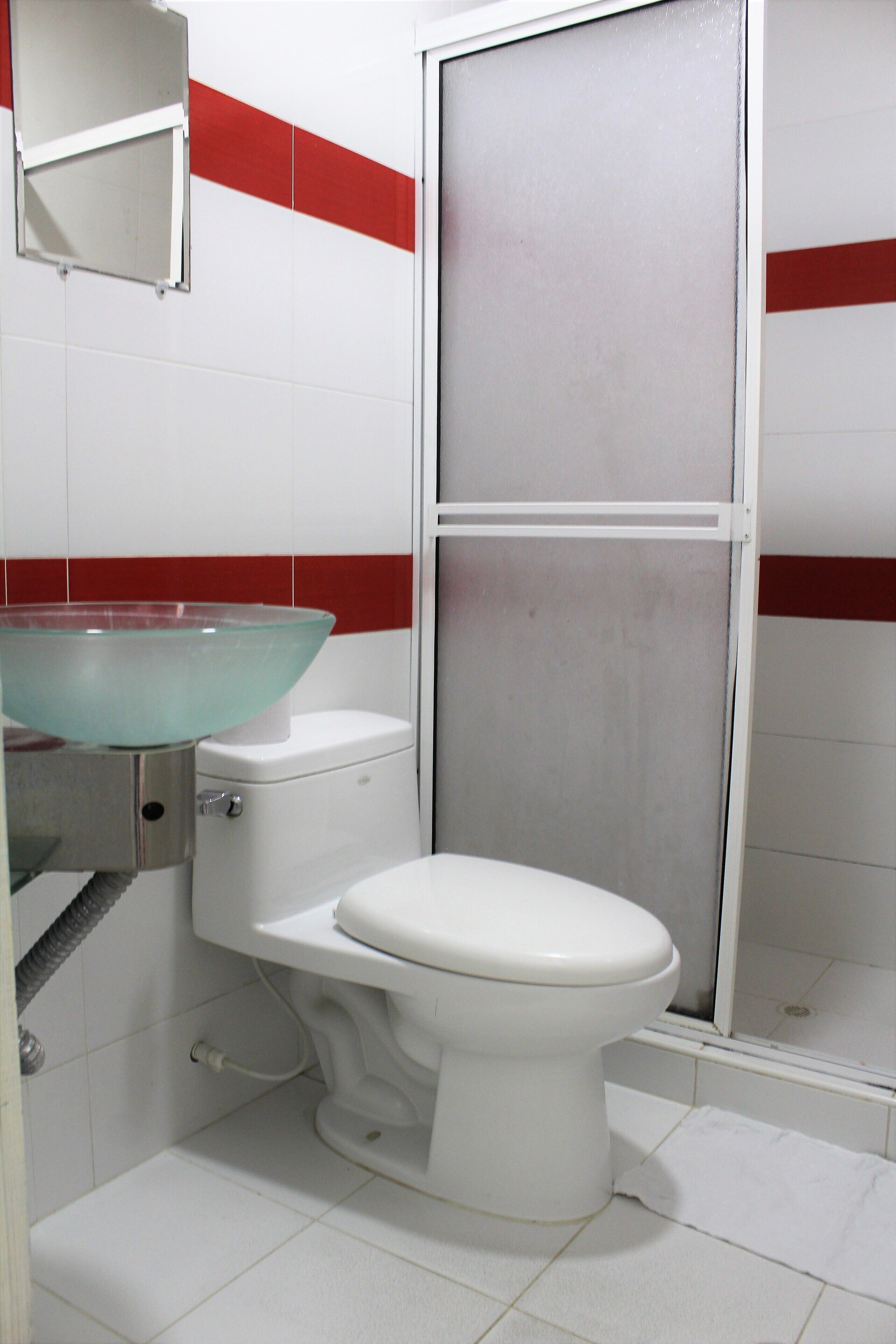 deluxe room | bathroom | shower, rainfall showerhead, towels