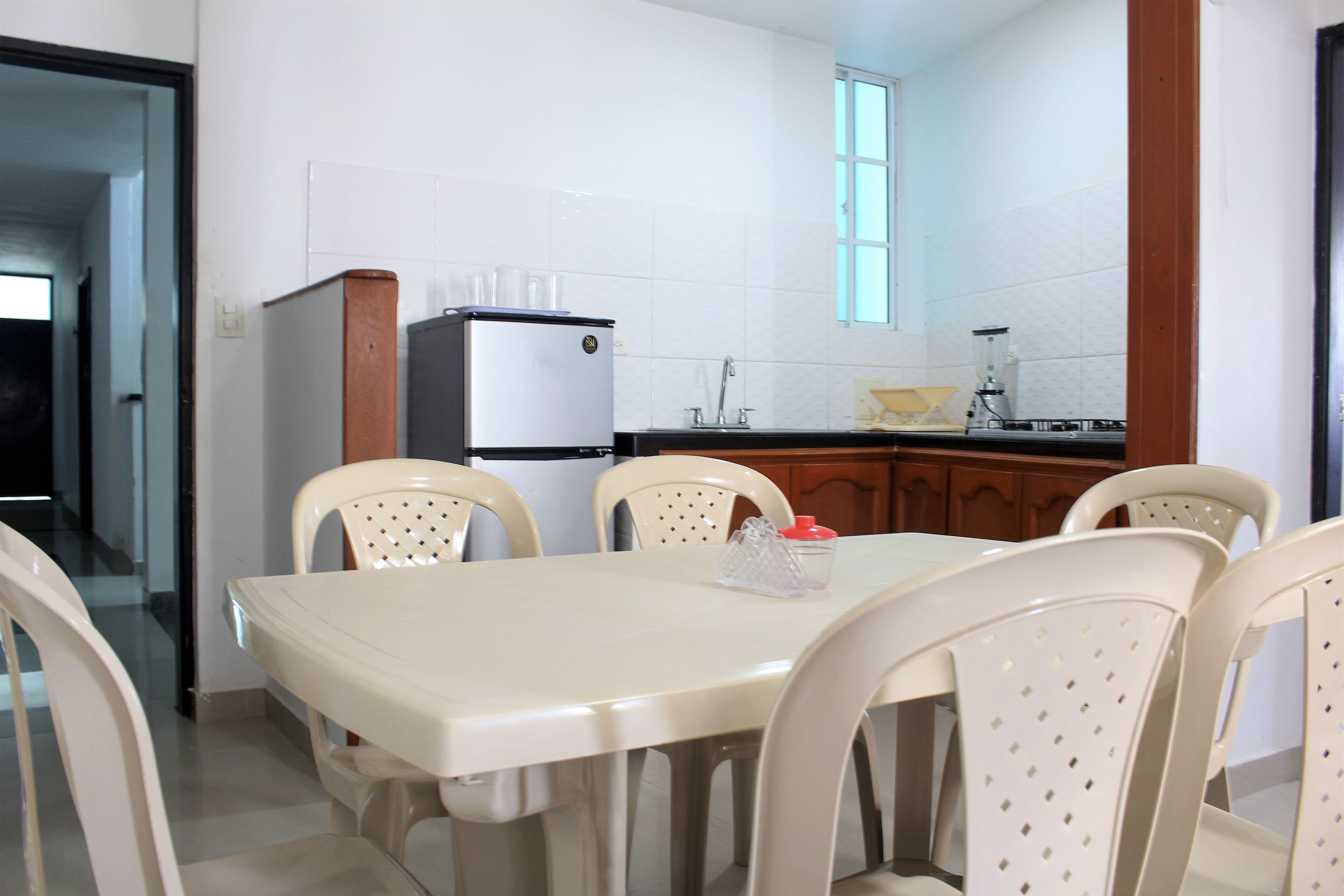 studio, multiple beds | private kitchen