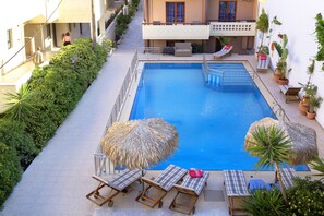 Outdoor pool, pool umbrellas, pool loungers