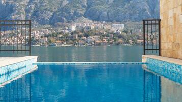 Seasonal outdoor pool, pool umbrellas, pool loungers