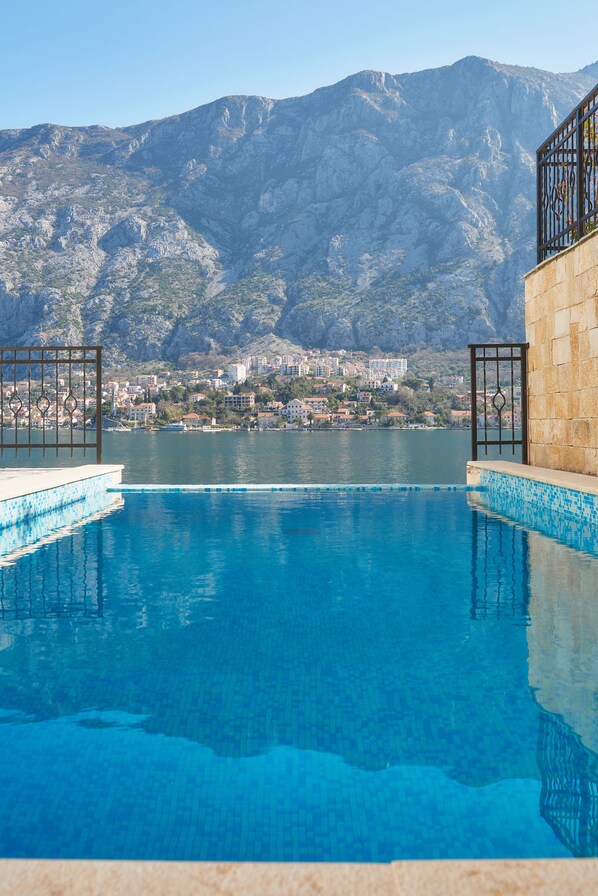 Seasonal outdoor pool, pool umbrellas, pool loungers