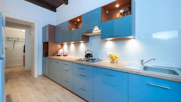 Design Apartment, 3 Bedrooms | Private kitchen | Full-sized fridge, microwave, stovetop, coffee/tea maker