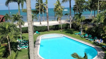 Outdoor pool, open 6:00 AM to 10:00 PM, pool loungers