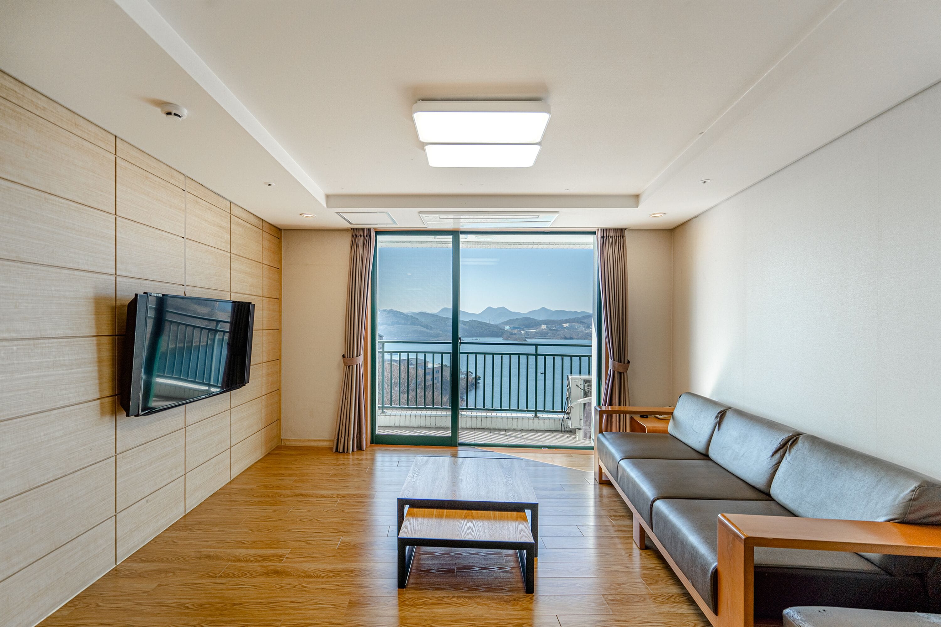 deluxe ondol room (hill house) (bedding and blanket) | living area | flat-screen tv