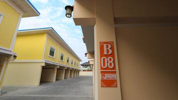 A parking area with a sign indicating 'B08' and 'Venice Resort & Hotel'.