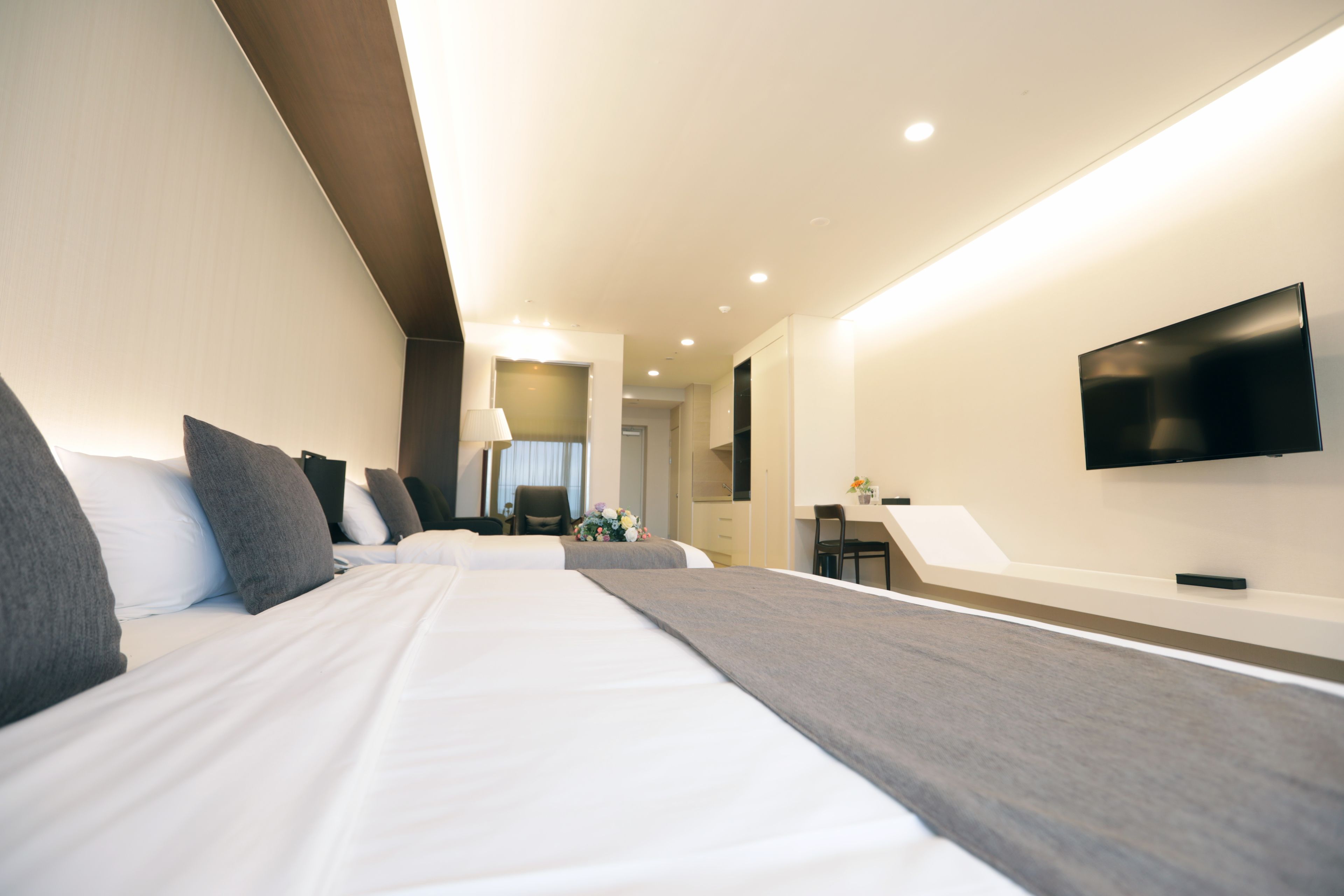 family twin room | in-room safe, desk, laptop workspace, blackout curtains