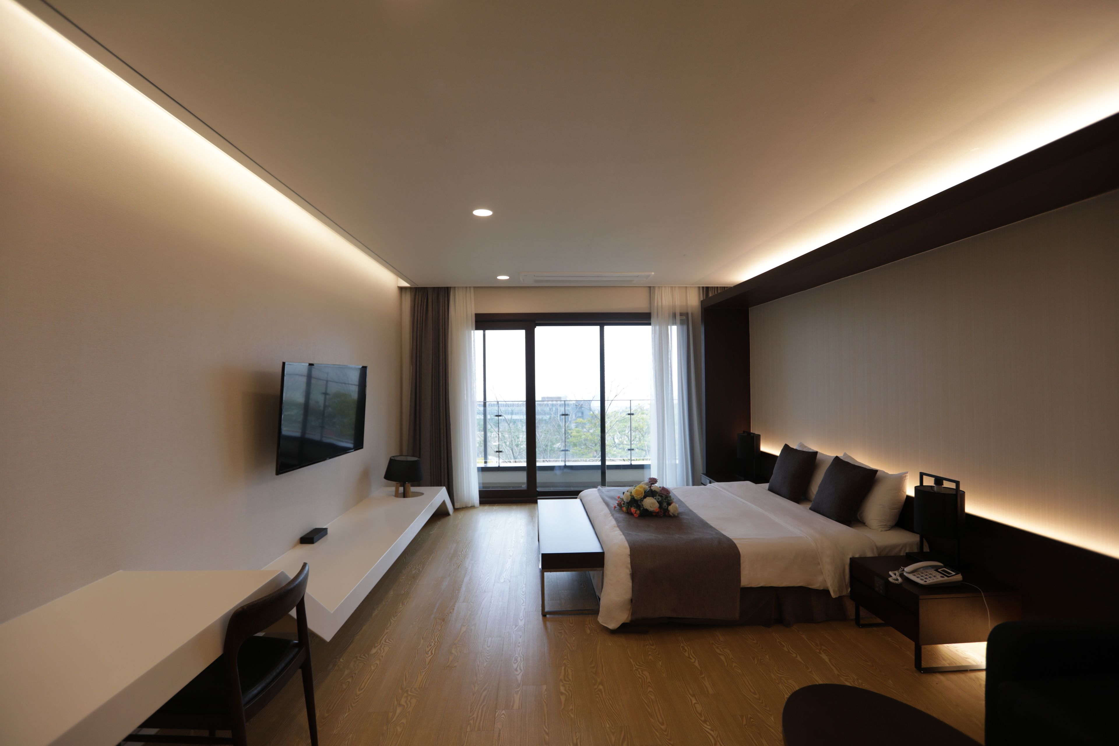 deluxe double room | in-room safe, desk, laptop workspace, blackout curtains