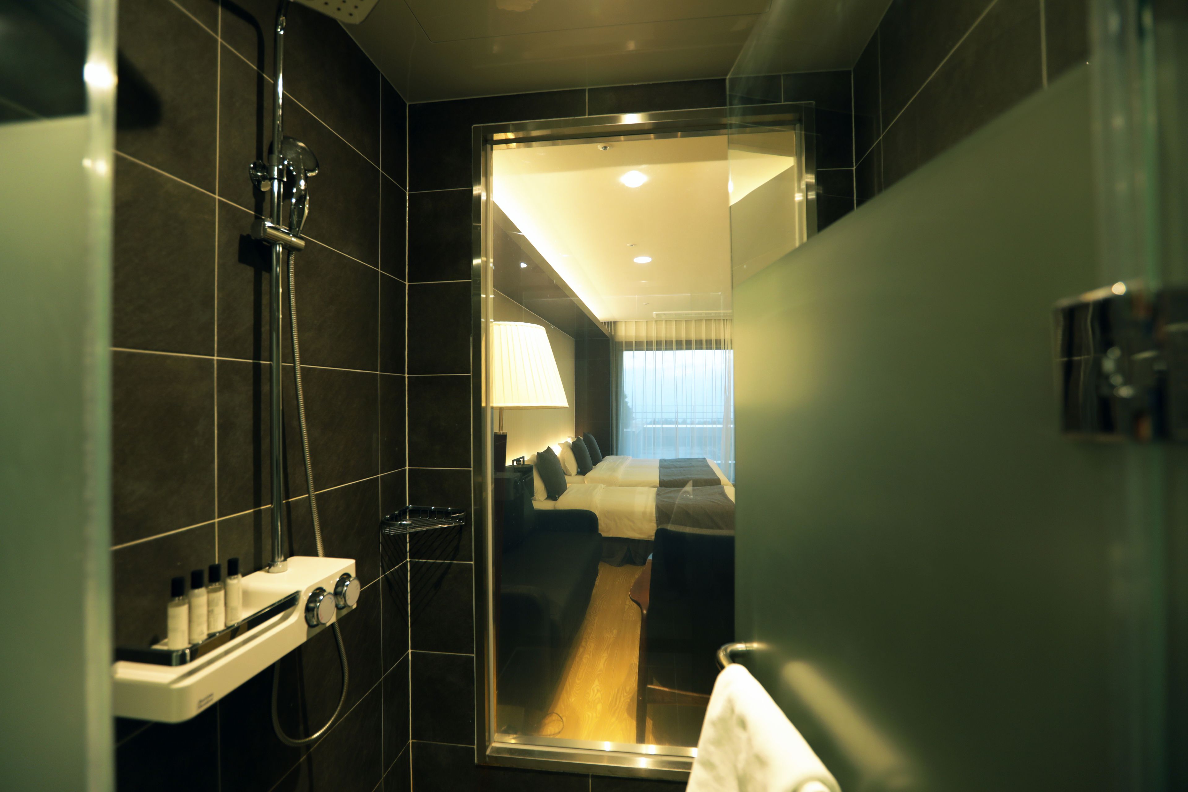 grand studio | bathroom | shower, hair dryer, bidet, towels