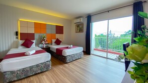 A hotel room with two beds, a large window with a balcony, and a modern headboard. - East Inn 15 Rayong (Rayong)