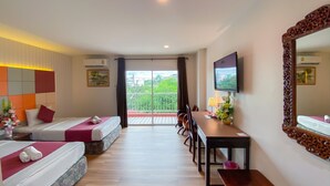 A hotel room with two beds, a dining table, a TV, and a balcony with a view. - East Inn 15 Rayong (Rayong)