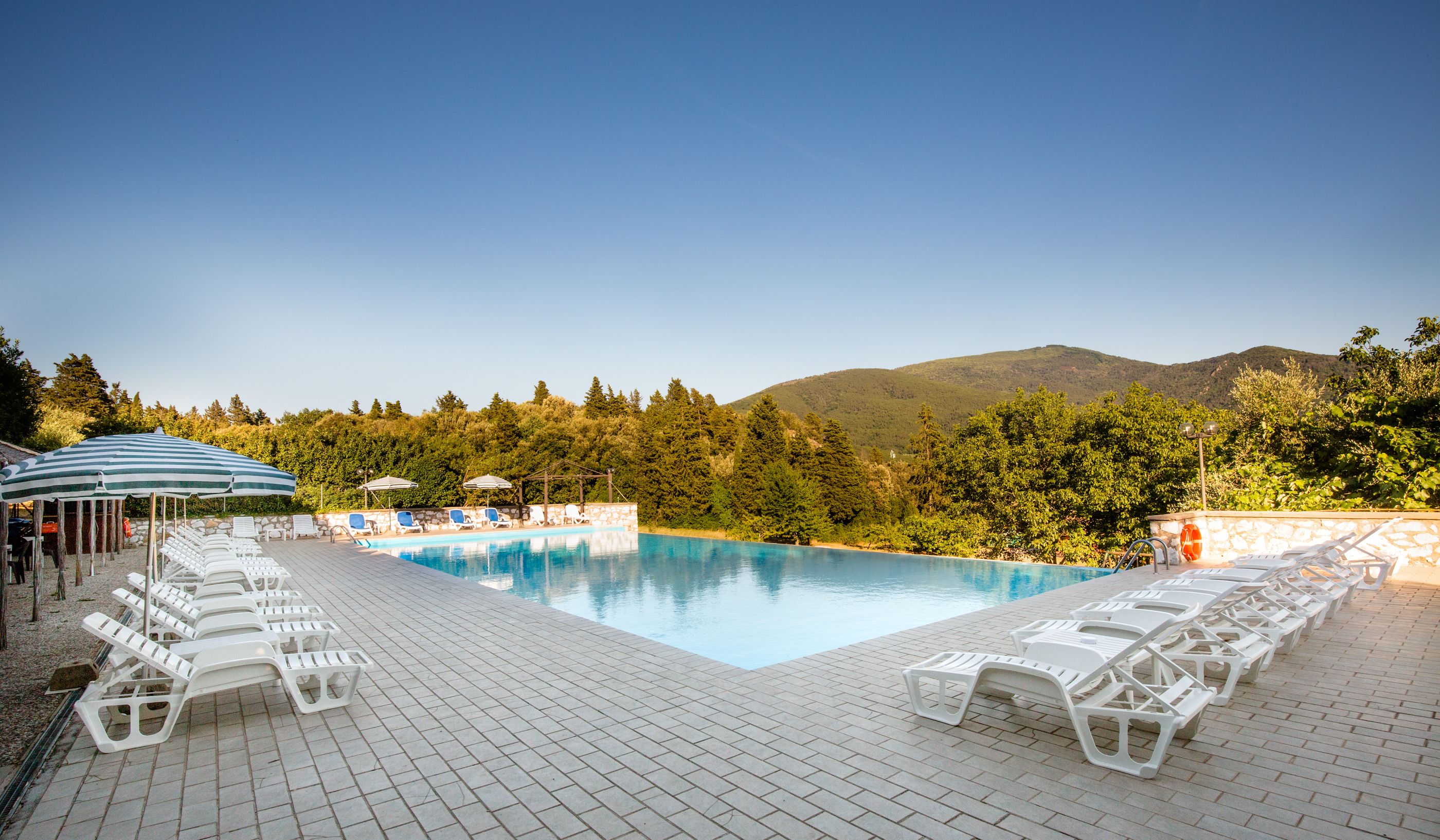 outdoor pool, open 7:30 am to 8:00 pm, pool loungers