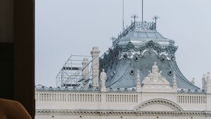 A view of a building with ornate architecture and a statue on the roof. - PURO Łódź Centrum (Lodz)