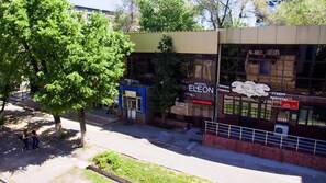 A building with a sign for 'ELEON' and 'Magic Tips'. - Hostel Eleon (Almaty)