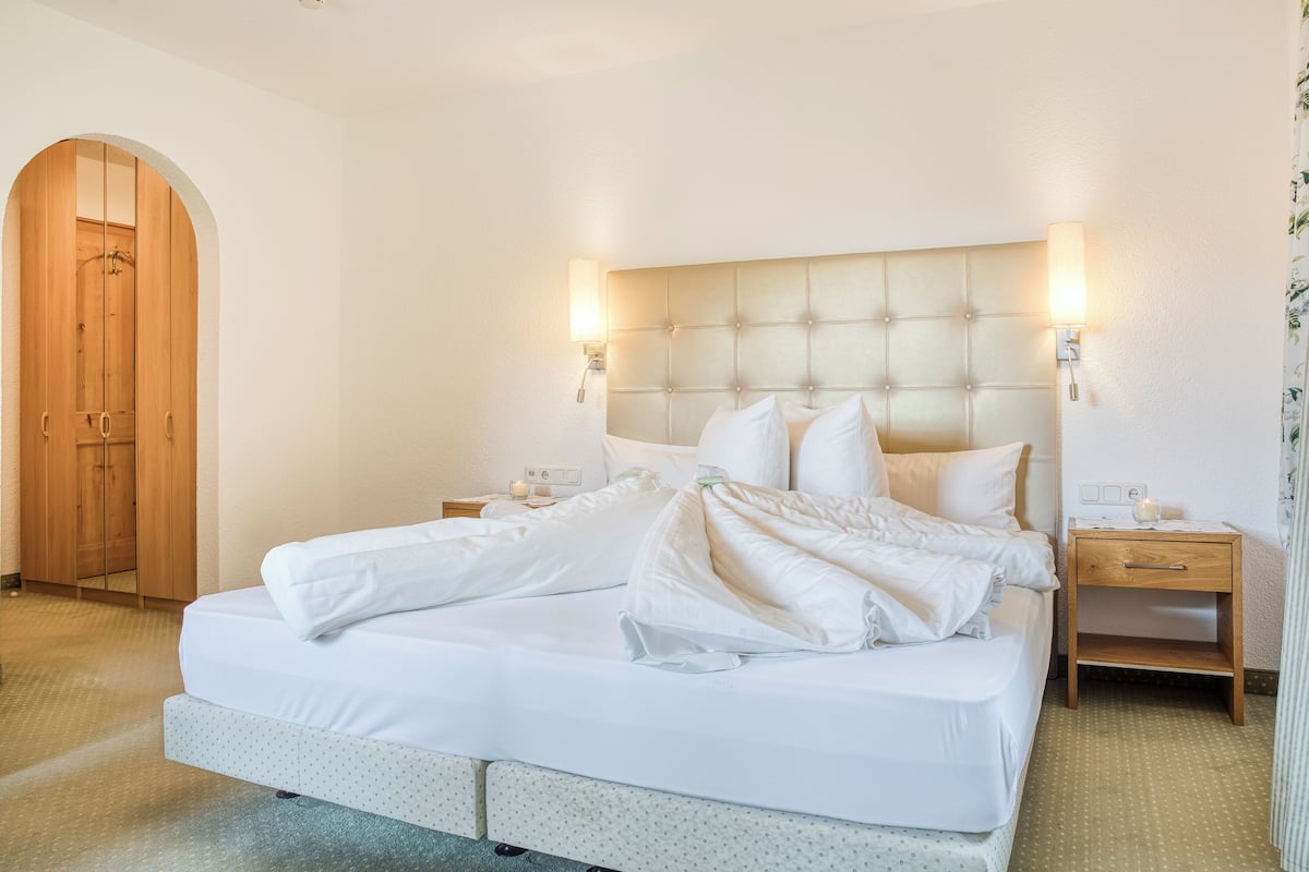 Family Room (2 Adults + 2 Kids) | Premium bedding, in-room safe, blackout drapes, free cribs/infant beds