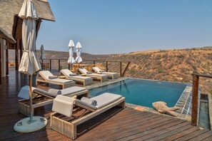 Outdoor pool, pool umbrellas, pool loungers