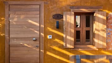 Deluxe Stone Room | 1 bedroom, down comforters, minibar, in-room safe