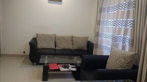 Quarto luxo, 1 cama King, para fumantes | Sala de estar