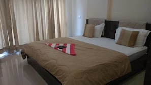 Blackout curtains, iron/ironing board, rollaway beds, free WiFi