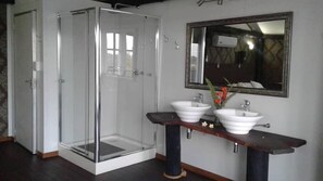 Luxury Suite, Non Smoking | Bathroom | Deep-soaking bathtub, rainfall showerhead, free toiletries, towels