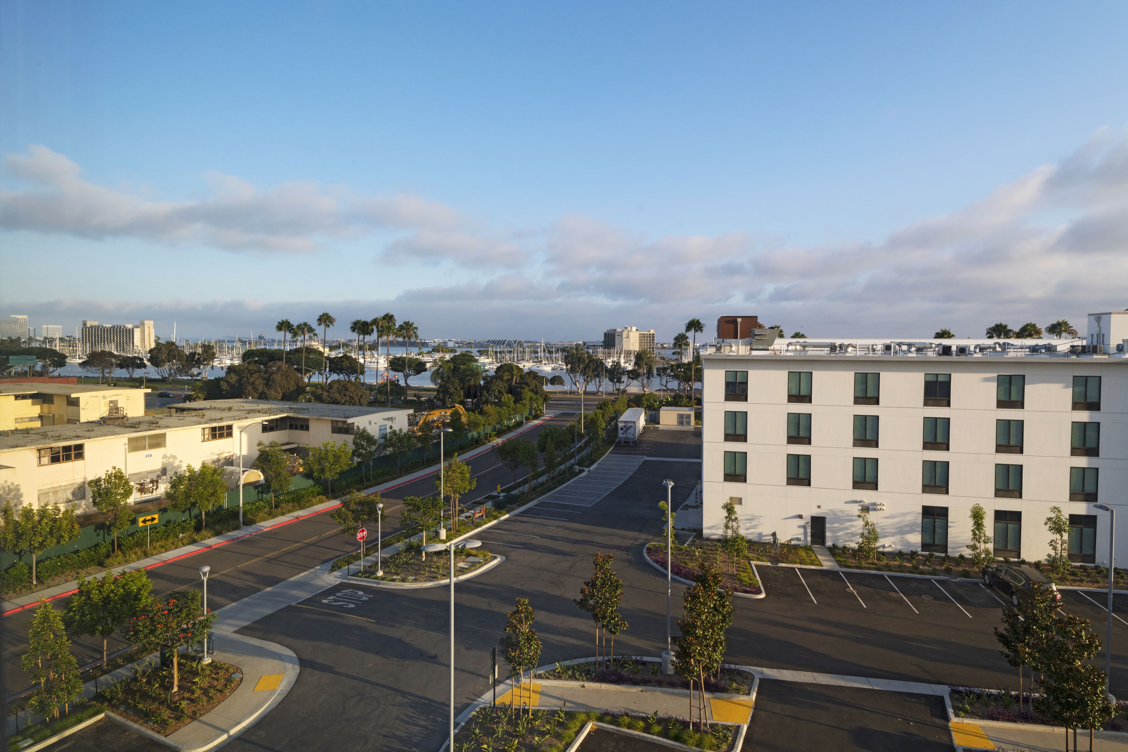A parking lot with a building in the background.