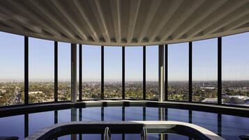 Indoor pool, open 7:00 AM to 10:00 PM, pool loungers