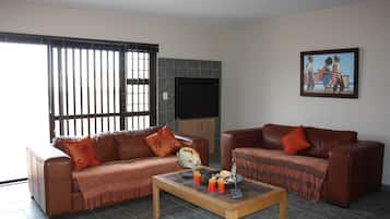 Apartment, 2 Bedrooms | Living room | 32-inch flat-screen TV with satellite channels, TV, fireplace