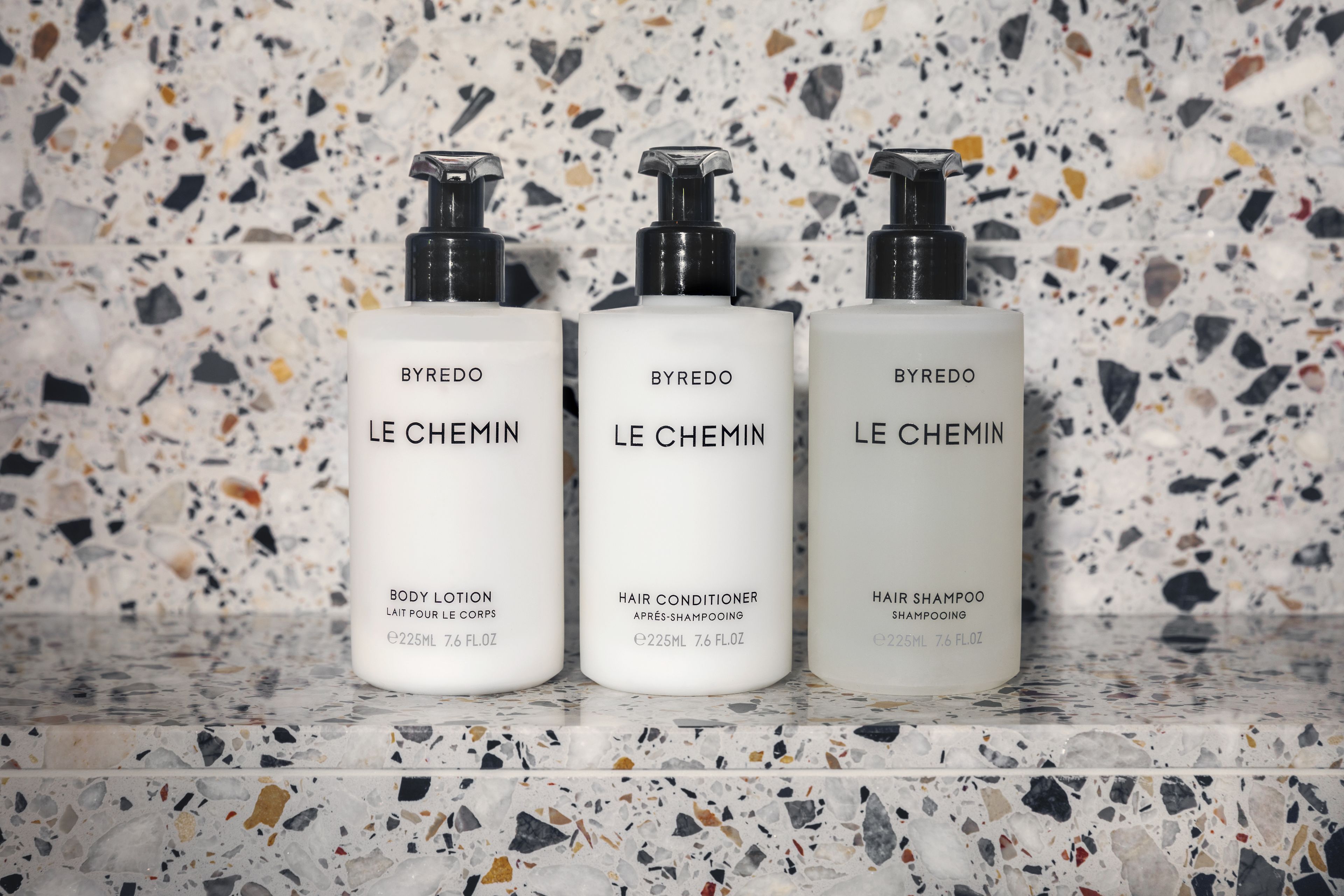 shower, designer toiletries, hair dryer, towels