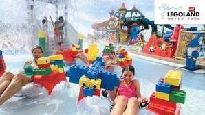 A water park with LEGO play structures and water slides. - Rove At The Park (Dubai)
