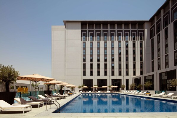 Outdoor pool, open 8:00 AM to 8:00 PM, pool umbrellas, pool loungers
