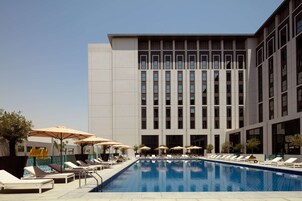 Outdoor pool, open 8:00 AM to 8:00 PM, pool umbrellas, sun loungers