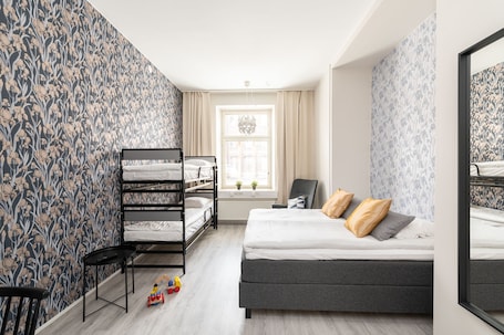 Family Room | Desk, laptop workspace, blackout drapes, soundproofing