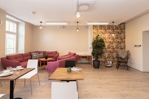 Flat-screen TV, table football, ping pong, books
