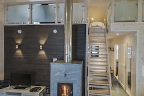 Apartment, 2 Bedrooms | Living room | 58-inch Smart TV with digital channels, TV, fireplace - Rukankarhu (Kuusamo)