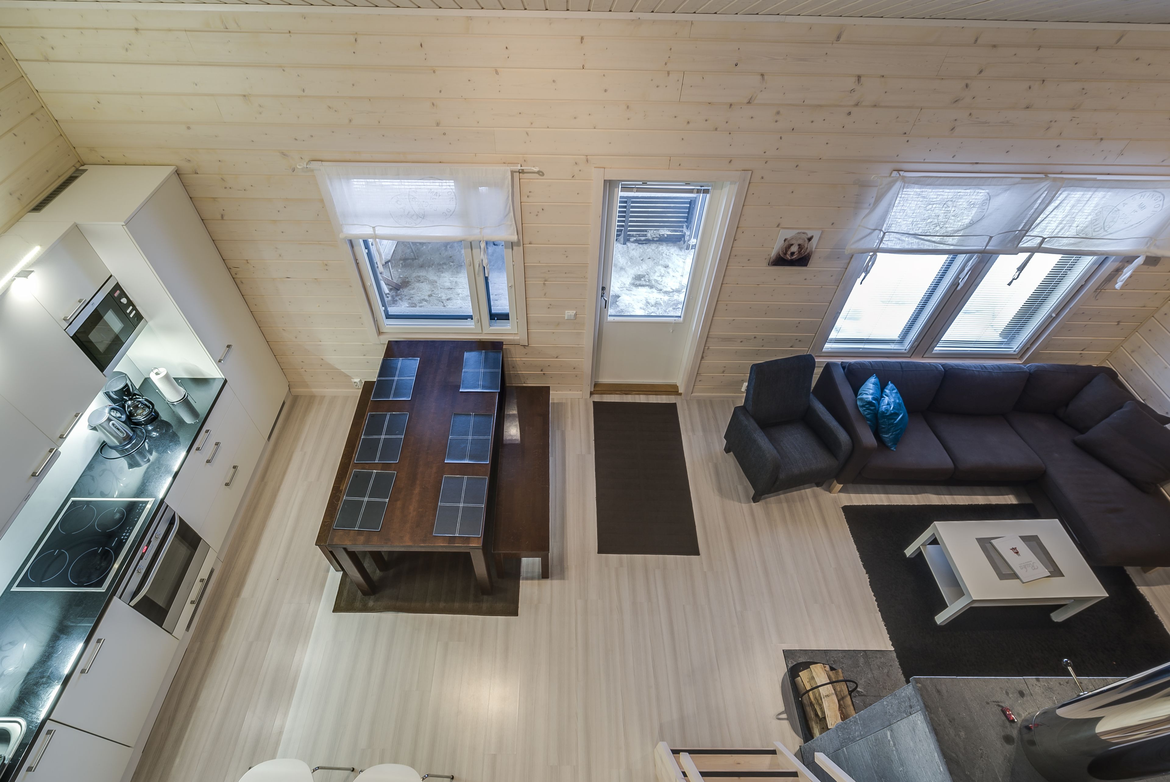 A compact living space with a kitchen, dining area, and seating area.