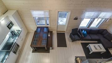 A compact living space with a kitchen, dining area, and seating area.