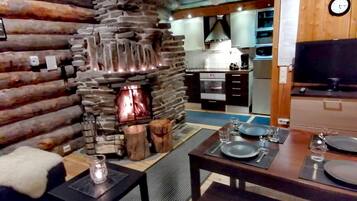 Apartment, Sauna (B6) | Living room | 32-inch flat-screen TV with digital channels, TV, fireplace